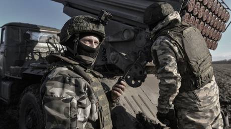 Russian servicemen aim a BM-21 Grad multiple launch rocket system at combat positions in the course of Russia's military operation in Ukraine, at the unknown location.