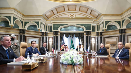 Russian Foreign Minister Sergey Lavrov (R) and Russian President Vladimir Putin's Foreign Policy Advisor Yuri Ushakov (2nd R) attend a meeting between Russia and the United States, in Riyadh, Saudi Arabia, on February 18, 2025.