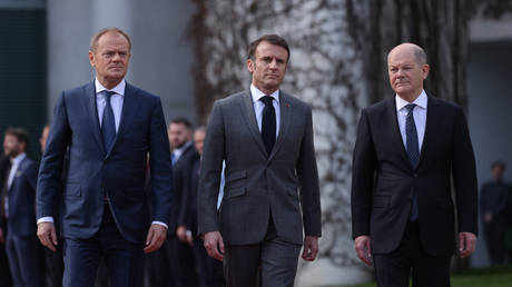 FILE PHOTO: Polish Prime Minister Donald Tusk, French President Emmanuel Macron and German Chancellor Olaf Scholz.